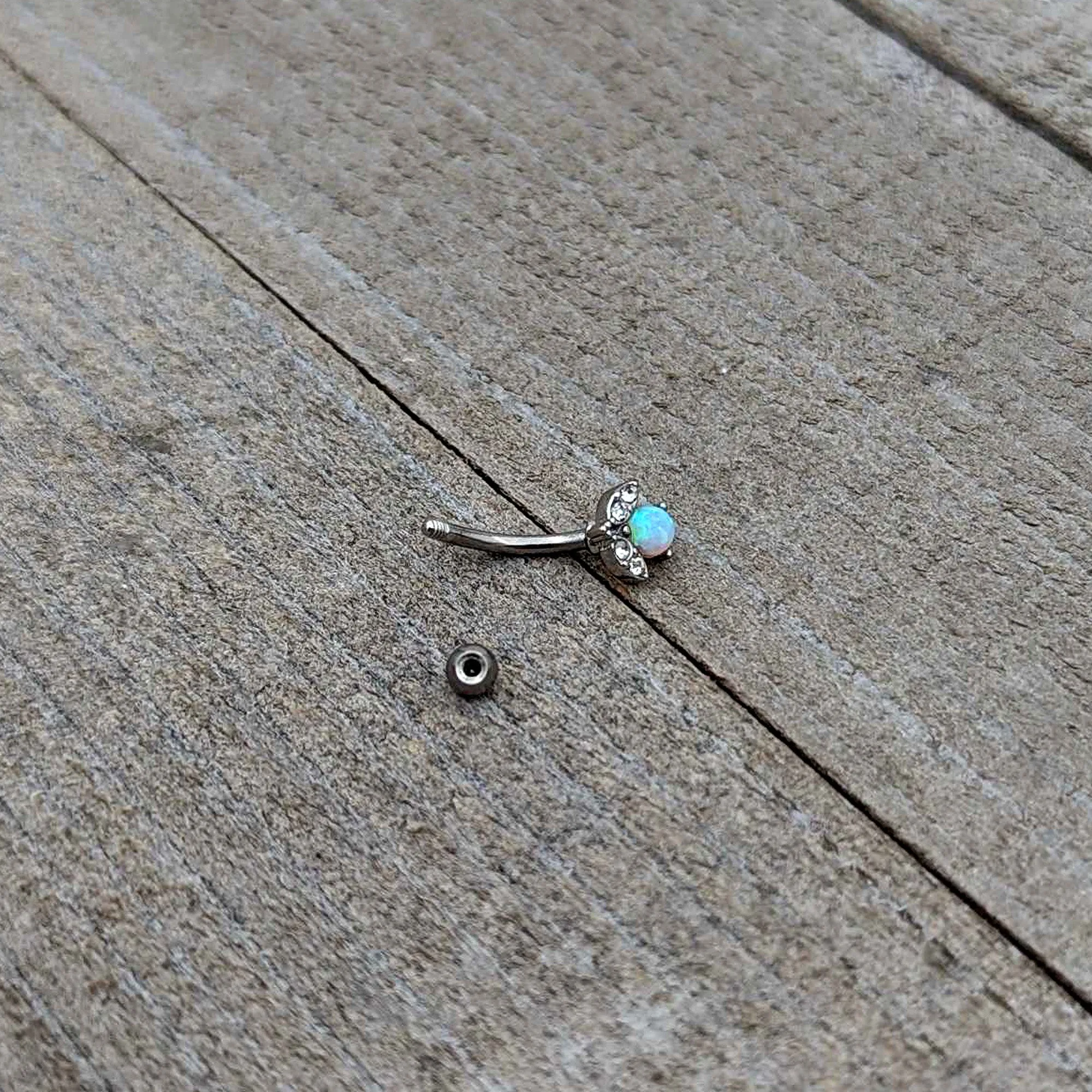 16 Gauge 5/16 White Synthetic Opal Style Flower Curved Eyebrow Ring