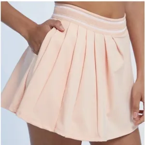 NWT Free People movement Round Robin skort in color peaches