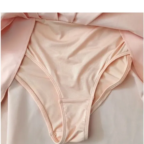 NWT Free People movement Round Robin skort in color peaches